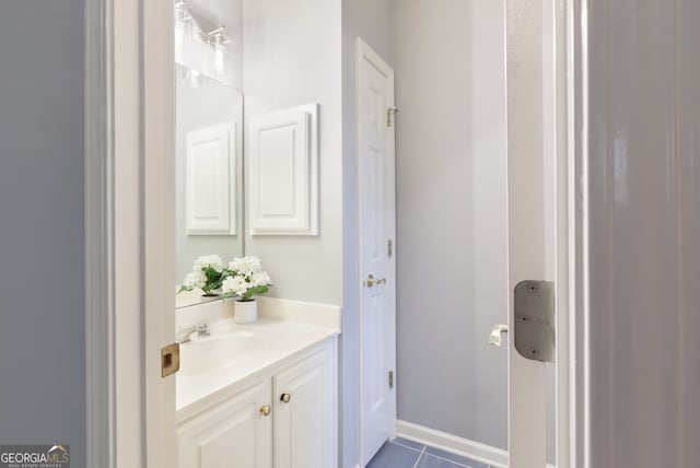 bathroom featuring tile patterned floors and vanity