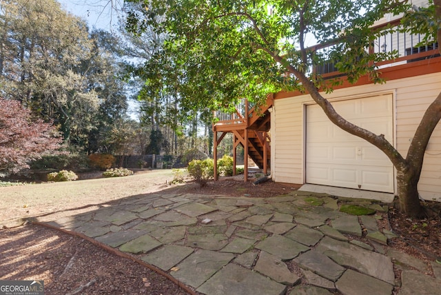 view of patio / terrace featuring a deck and a garage