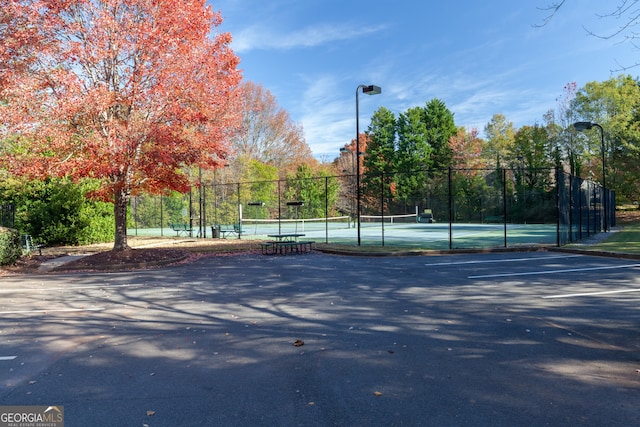 view of basketball court featuring tennis court