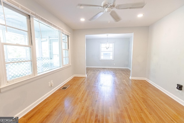 spare room with ceiling fan and light hardwood / wood-style flooring