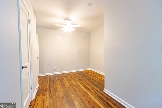 empty room featuring ceiling fan and wood-type flooring