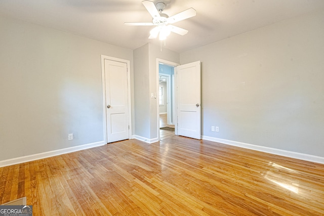 unfurnished room with ceiling fan and light hardwood / wood-style floors