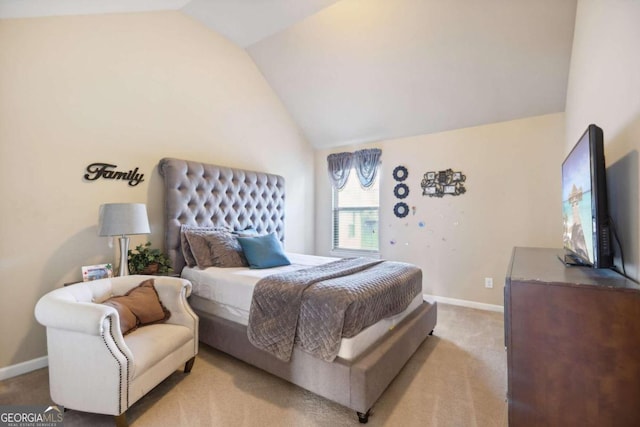 bedroom featuring lofted ceiling, baseboards, and light colored carpet