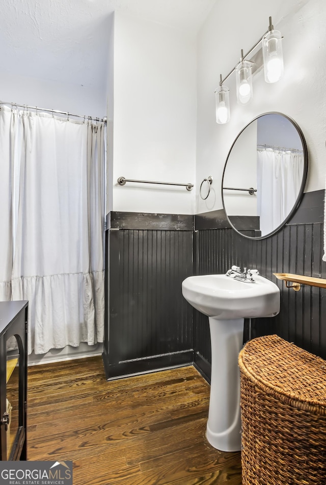 bathroom with hardwood / wood-style flooring