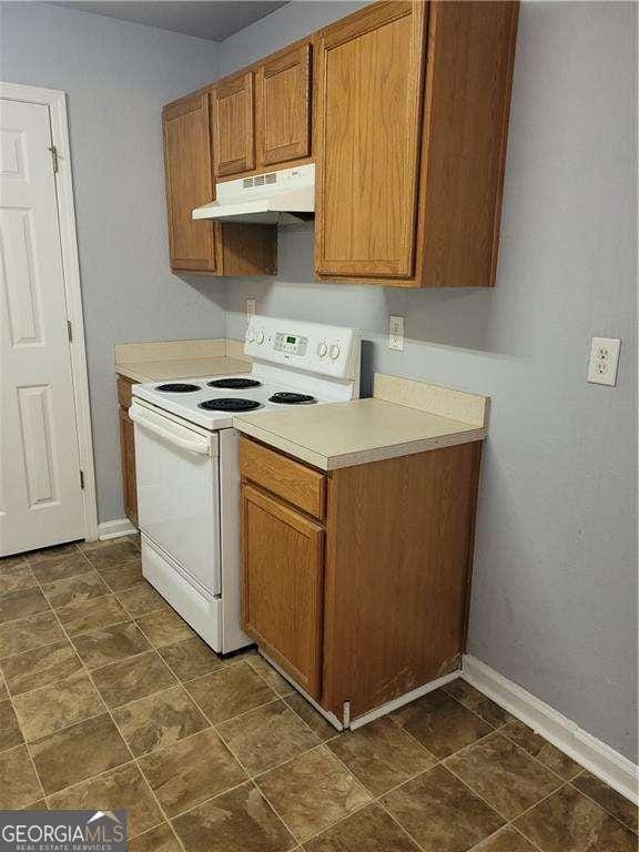 kitchen with white range with electric cooktop