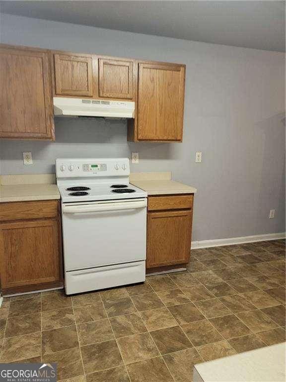 kitchen with white range with electric cooktop