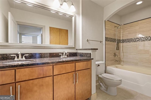 full bathroom with tile patterned floors, vanity, toilet, and tub / shower combination