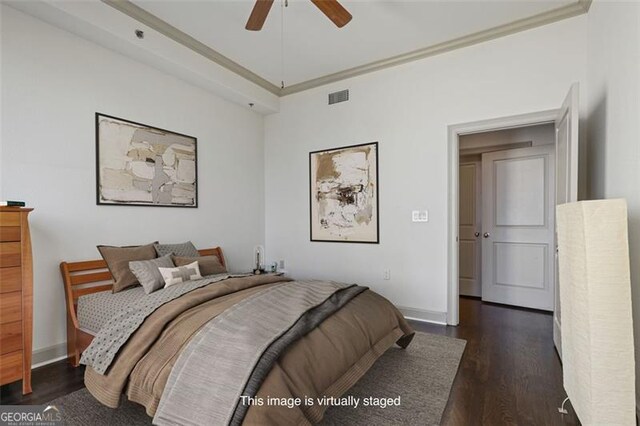 bedroom with ceiling fan and dark wood-type flooring