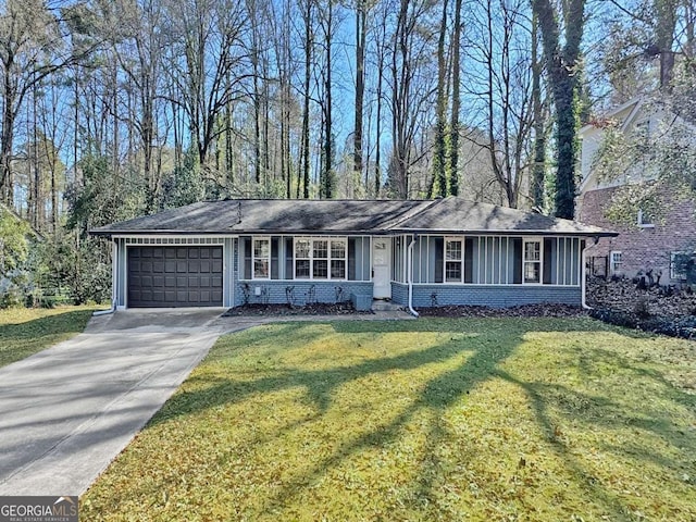 single story home with a front yard and a garage