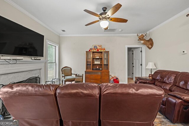 192 Celestial Run, Winder, GA 30680 - living room with crown molding, ceiling fan, and a fireplace
