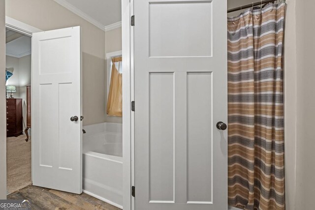 192 Celestial Run, Winder, GA 30680 - full bathroom with crown molding, a tub to relax in, and a shower with shower curtain