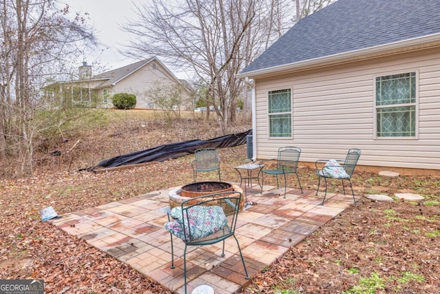 view of patio featuring a fire pit