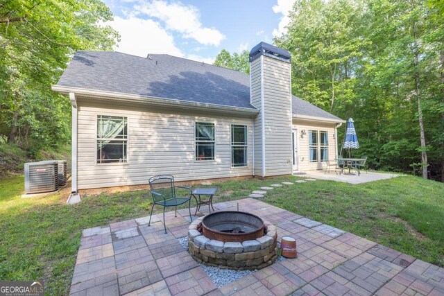 192 Celestial Run, Winder, GA 30680 - rear view of property featuring cooling unit, a patio, a fire pit, and a lawn
