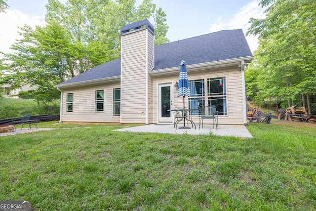 192 Celestial Run, Winder, GA 30680 - rear view of house featuring a patio area, a yard, and a chimney