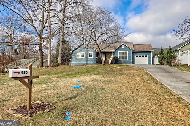 single story home with a front yard and a garage