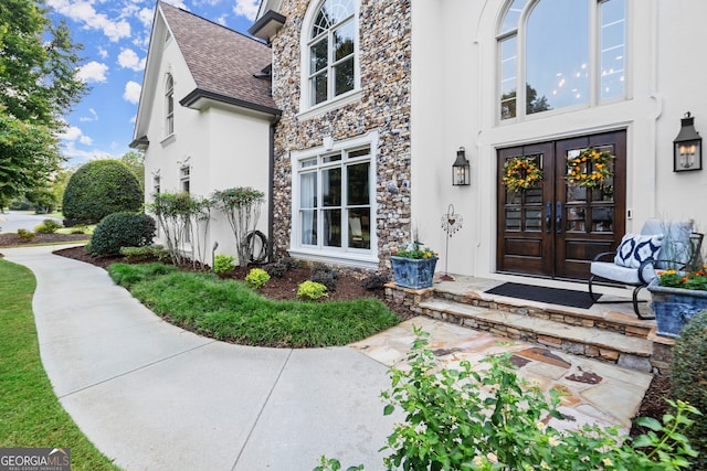 doorway to property with a patio area and french doors