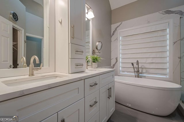 bathroom featuring a bathtub and vanity