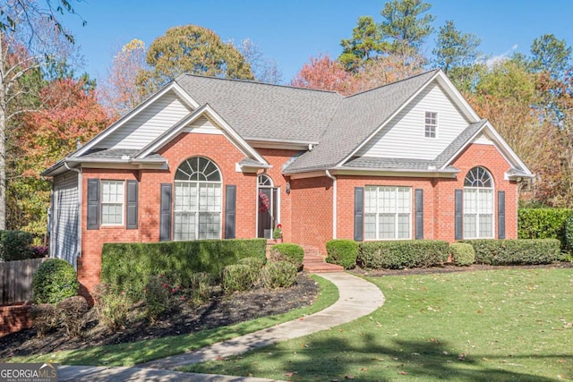 front facade with a front yard