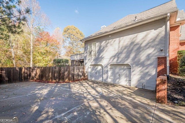 view of property exterior with a garage