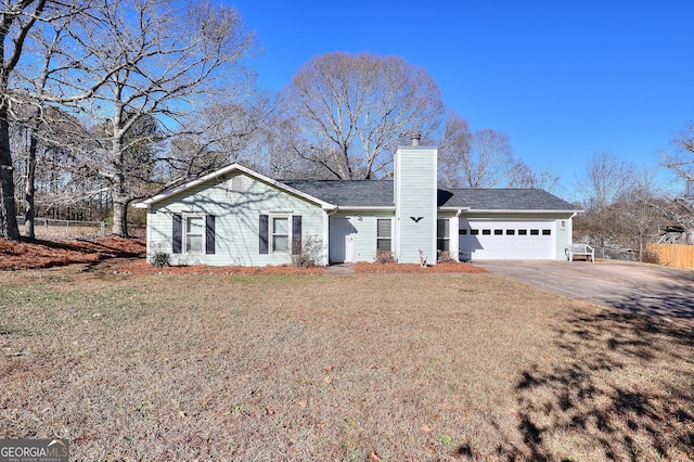 ranch-style house with a front yard and a garage