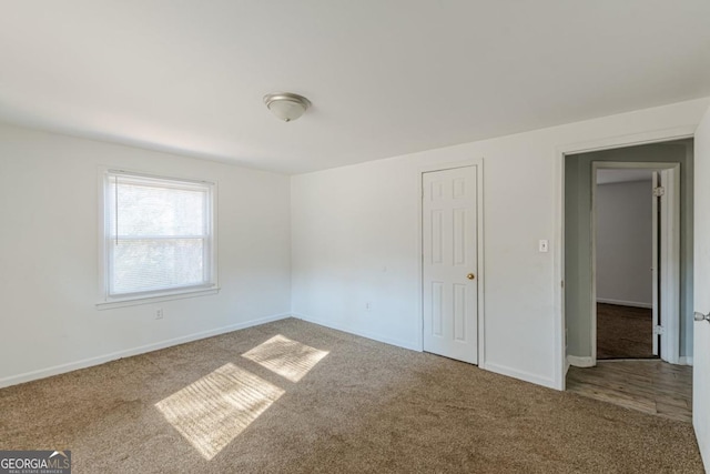 unfurnished bedroom featuring carpet flooring