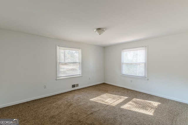 unfurnished room with carpet floors