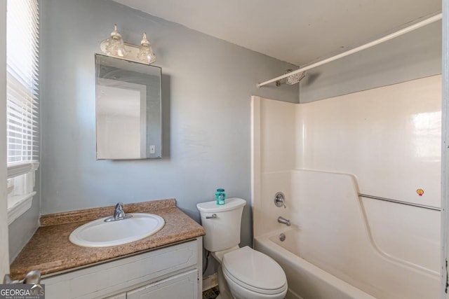 full bathroom featuring shower / washtub combination, vanity, and toilet