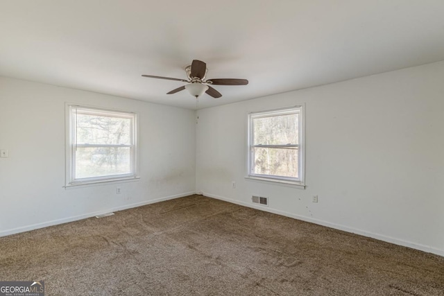 carpeted empty room with ceiling fan