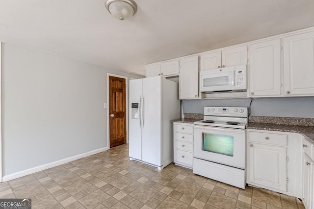 kitchen featuring white cabinets and white appliances