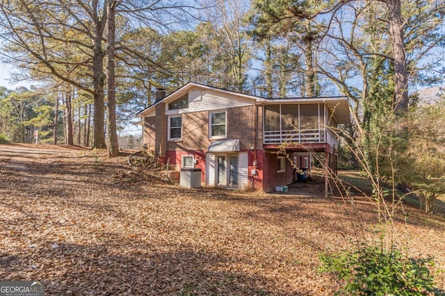 view of front of home featuring a sunroom