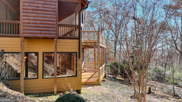 view of home's exterior with a wooden deck