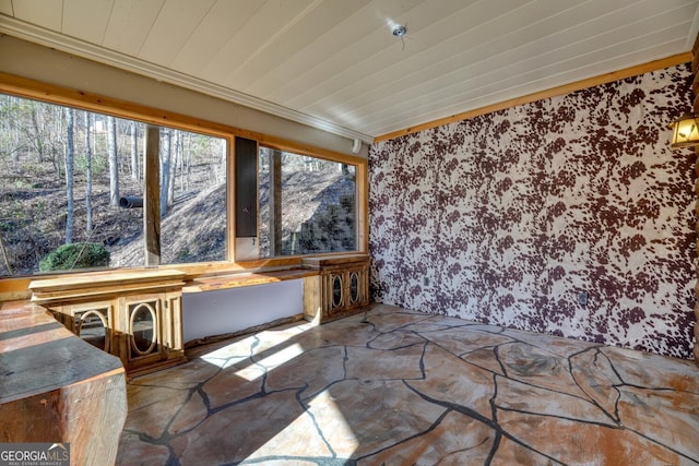 unfurnished sunroom featuring wood ceiling