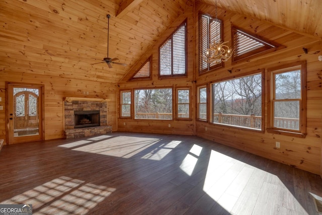 unfurnished living room featuring ceiling fan with notable chandelier, dark hardwood / wood-style flooring, wooden ceiling, and high vaulted ceiling