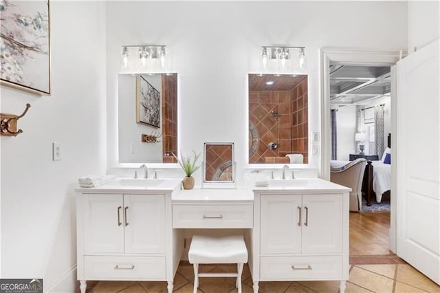 bathroom with tile patterned floors and vanity