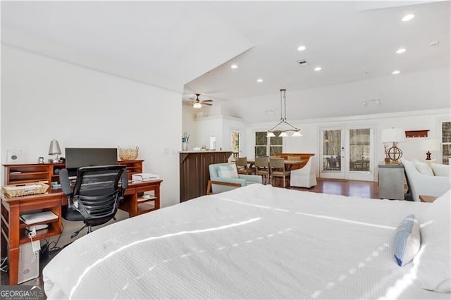 bedroom with lofted ceiling and french doors