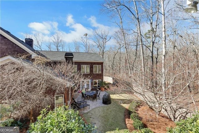 rear view of property with a patio area