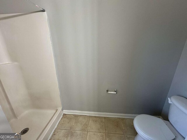 916 Brisley Cir, Hampton, GA 30228 - bathroom featuring walk in shower and toilet