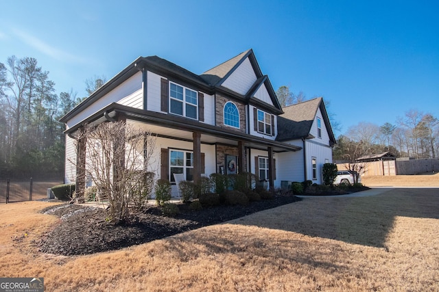 view of front of home featuring a front yard and covered porch