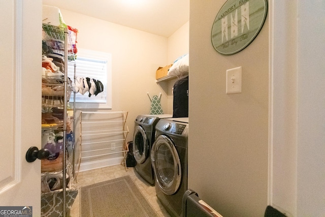 clothes washing area featuring washing machine and clothes dryer