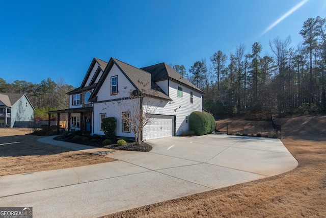 view of side of home with a garage