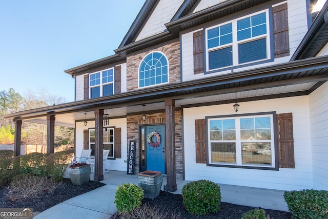 property entrance featuring a porch