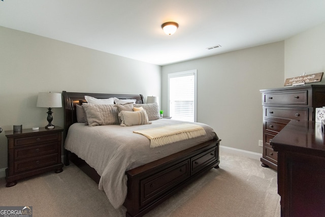 bedroom with light colored carpet