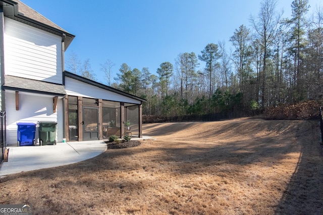 view of yard with a sunroom