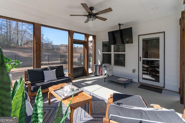 sunroom / solarium with ceiling fan