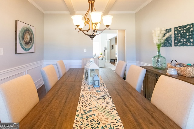 dining area with an inviting chandelier and ornamental molding