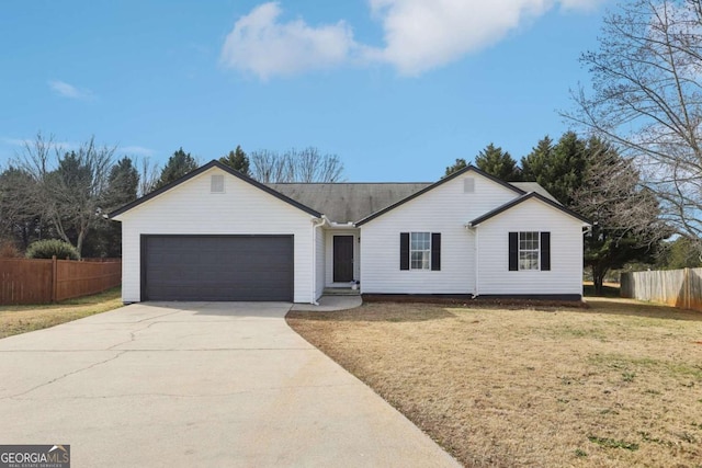 ranch-style home with a garage and a front yard