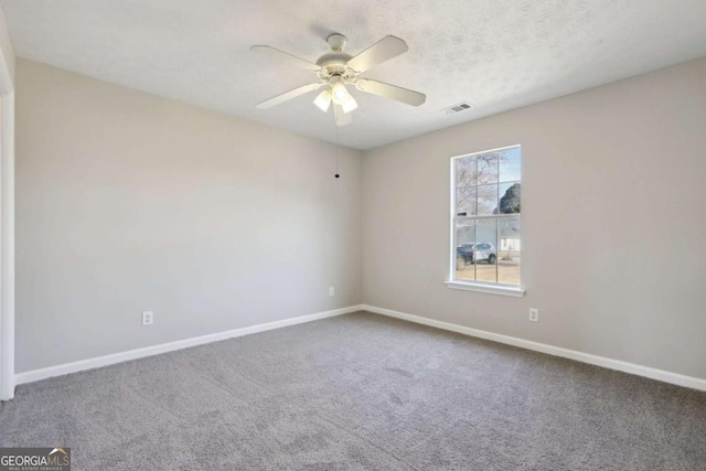 unfurnished room featuring carpet flooring and ceiling fan