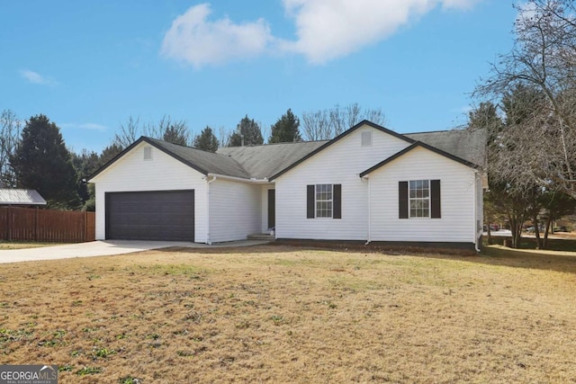 ranch-style house with a garage and a front lawn