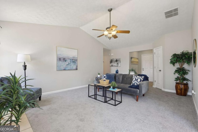 living room featuring tile patterned floors, ceiling fan, and lofted ceiling