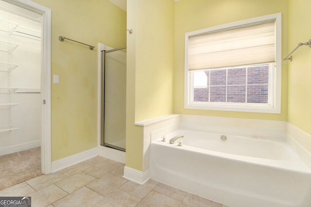 bathroom featuring tile patterned floors and plus walk in shower